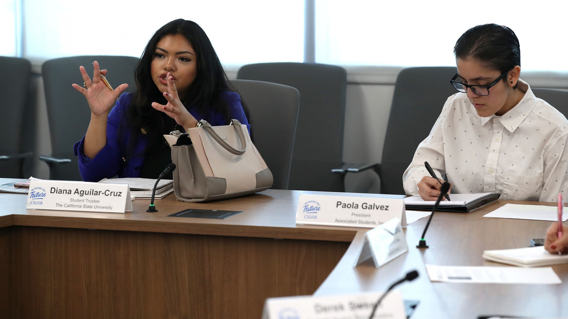 CSU Student Trustee Diana Aguilar-Cruz, left, attends a CSUSB ASI meeting with ASI President Paola Galvez.