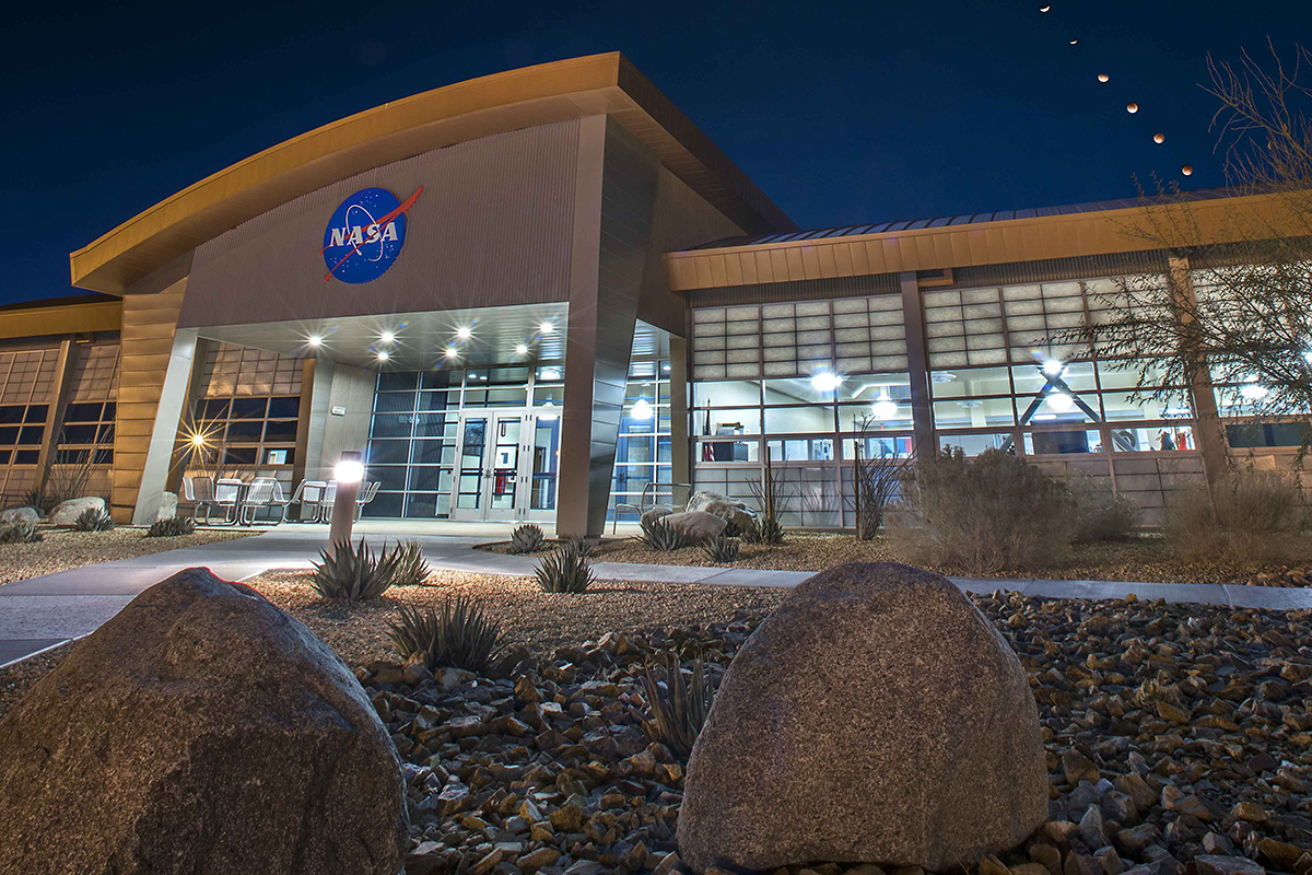 The NASA Armstrong Flight Research Center’s mission support building with a composite of 16 images of the eclipsed moons overhead during Jan. 31, 2018, Super Blue Blood Moon. Photographer: NASA/Ken Ulbrich