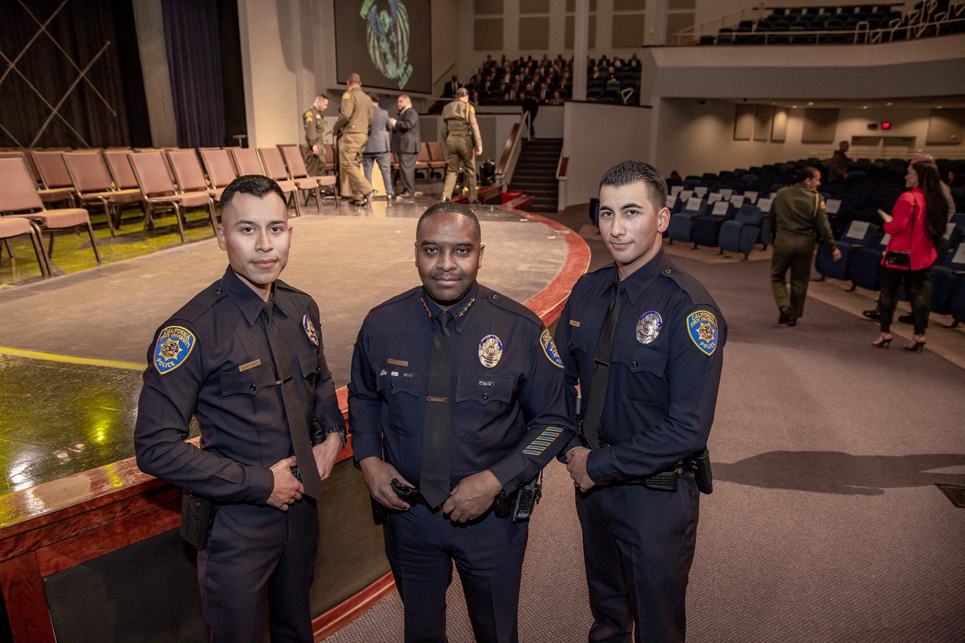John Guttierrez (center), CSUSB acting police chief, stands with the department’s newest officers, Victor Rodriguez (left) and Raudel Garcia-Reynoso (right) at the San Bernardino County Sheriff’s Basic Academy graduation. The new officers are CSUSB graduates.