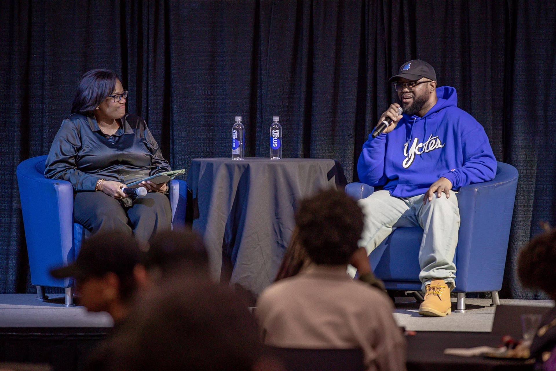  Daria Graham (left), associate vice president for Student Affairs and dean of students, moderated the program that featured Terrence Floyd at CSUSB's Social Justice Summit.>>