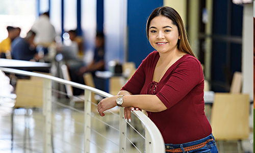 Student standing at railing