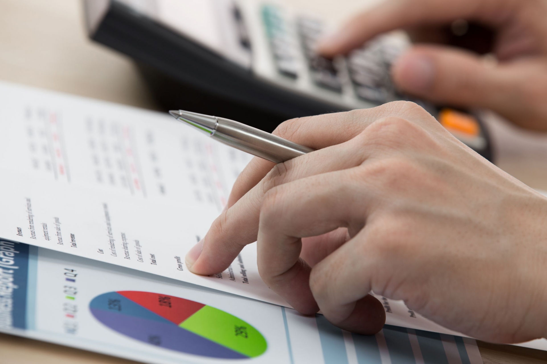 accountant at work with calculator
