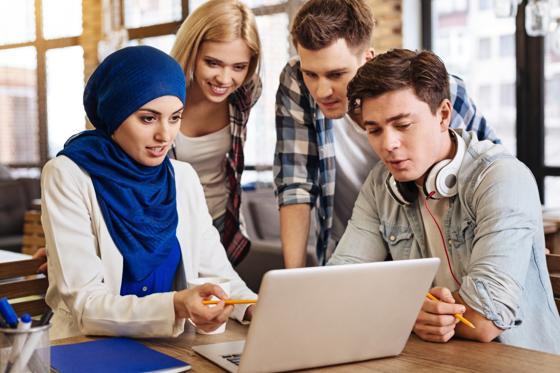 Students looking at a computer