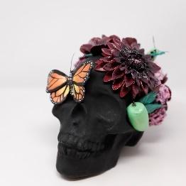 decorated calavera with butterfly and flowers