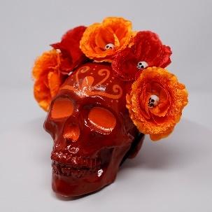 crimson flower decorated calavera
