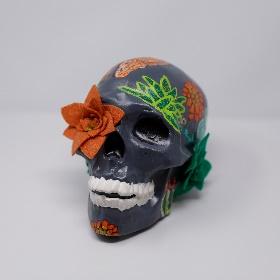 decorated calavera with flower in eye