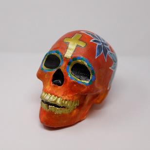 decorated calavera with cross on head