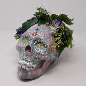 decorated calavera with leaves