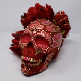 red flower decorated calavera