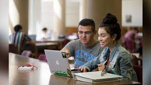 students using a laptop