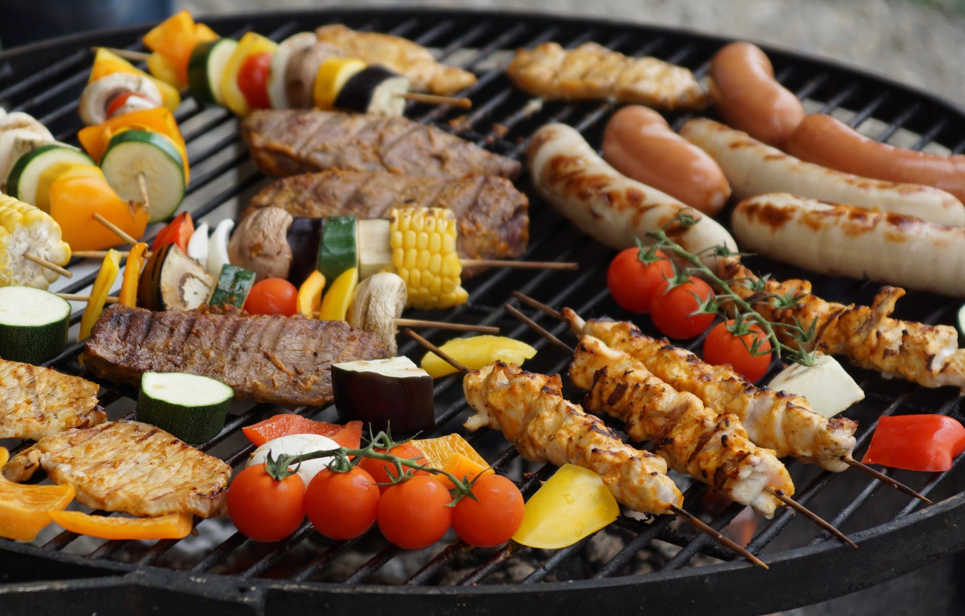 Photo of cooked chicken, tomato, kaboob, and corn. 