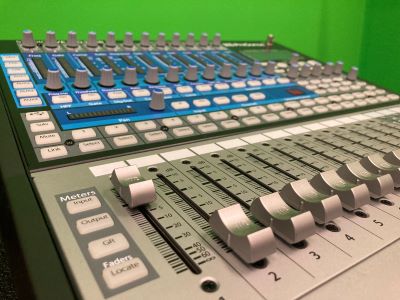 Close-up image of a sound mixing board.