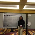 Student in front of poster 2