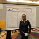 Student in front of poster 5
