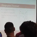 People looking at projection