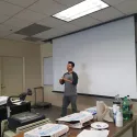 Guy Standing in Front of Classroom