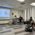 lucy giving a presentation about Mural workshop
