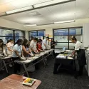 Students learning how to make spring rolls