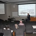 Guy lecturing to a lecture hall