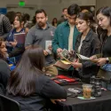 students speaking with employers at table