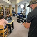 Camille working with students