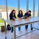 Guadalupe working with friends on campus