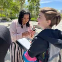 Tierra working to show her podcast created here at CSUSB with the TCT team