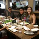Advisor and student enjoy dinner