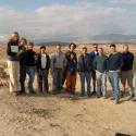 People standing on beach or desert ocean not visible