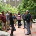 People standing in stone sitting area
