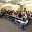 People sitting in seats paying attention