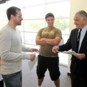 Four people having animated discussion