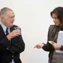 Man and woman standing next to each other talking