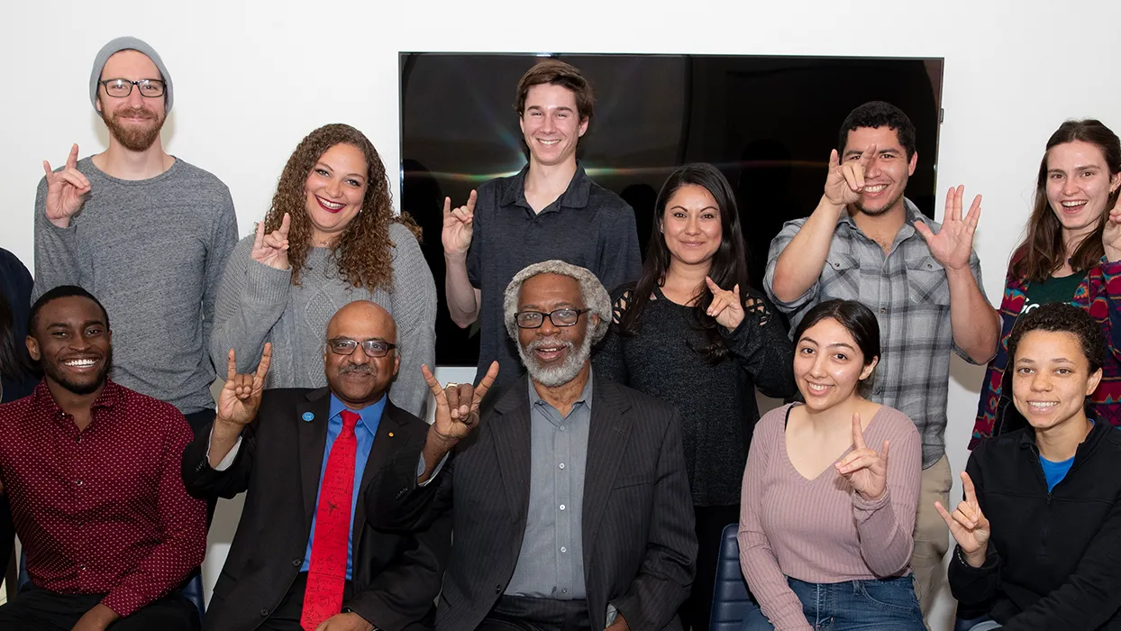 Sylvester James “Jim” Gates posing with CSUSB students and staff