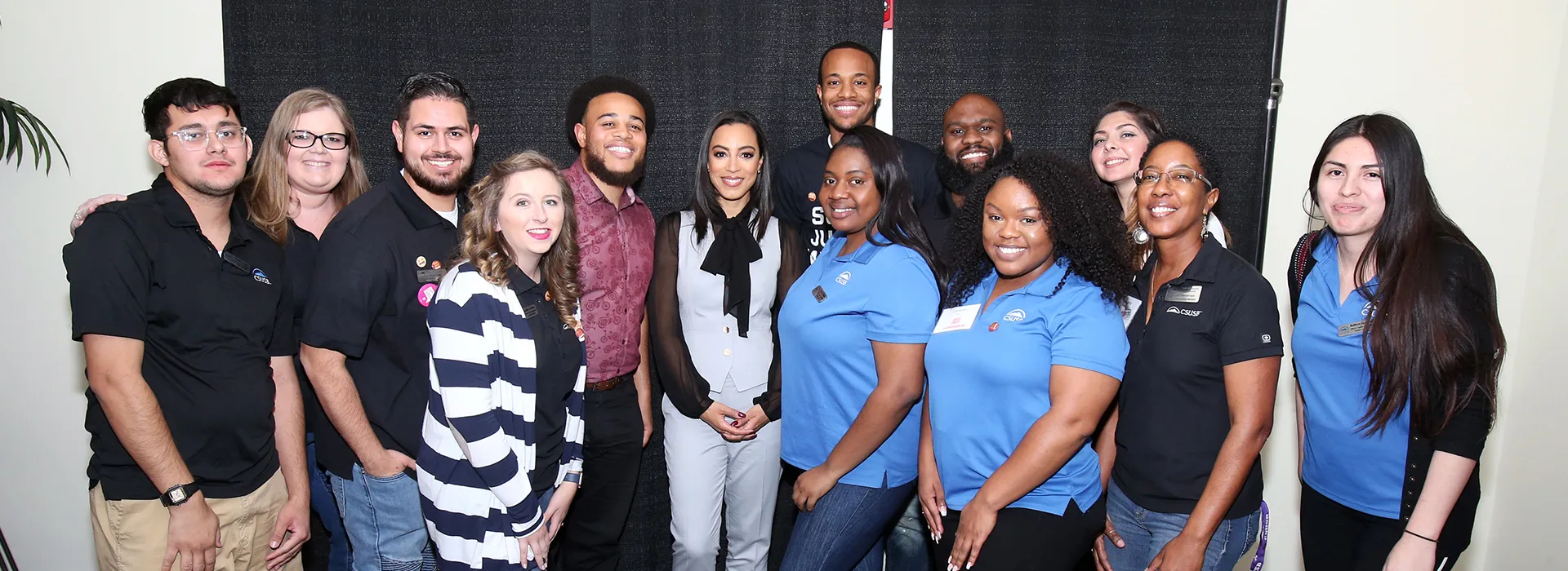 Angela Rye (center, wearing the black bow) with some of the staff from the CSUSB Office of Student Engagement