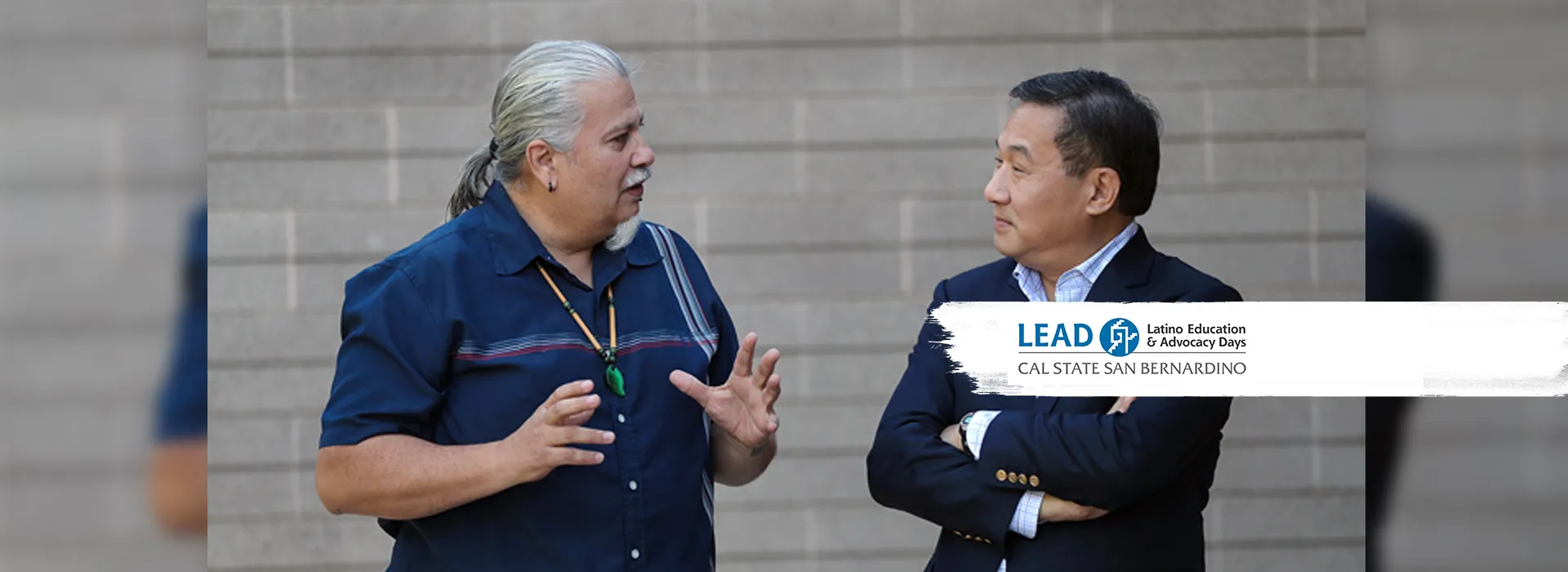 Enrique Murillo Jr. (l), Professor of education an executive director of LEAD, is interviewed by PBS NewsHour reporter John Yang