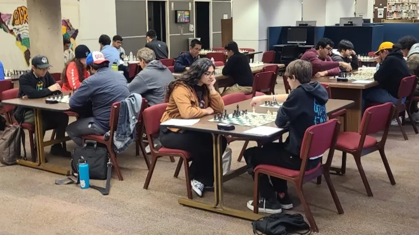 Participants in the Pfau Library’s third Chess Tournament face off against each other.