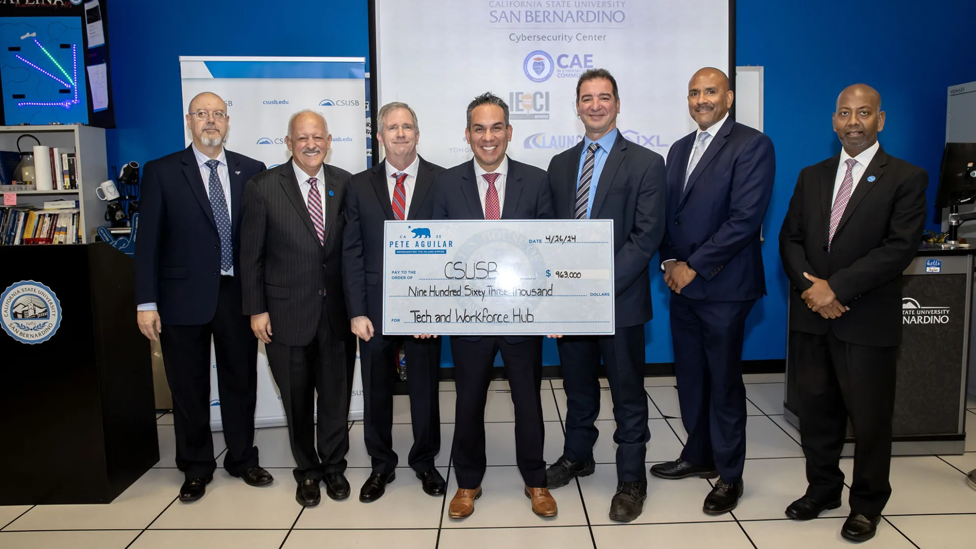 From left: Tomás Gómez-Arias, dean of the Jack H. Brown College of Business and Public Administration; Tomás D. Morales, CSUSB president; Tony Coulson, executive director of the CSUSB Cybersecurity Center; U.S. Rep. Pete Aguilar, D-San Bernardino; Vincent Nestler, director of the CSUSB Cybersecurity Center; Rafik Mohamed, provost and vice president of Academic Affairs; Sam Sudhakar, chief financial officer and vice president, Finance, Technology and Operations.