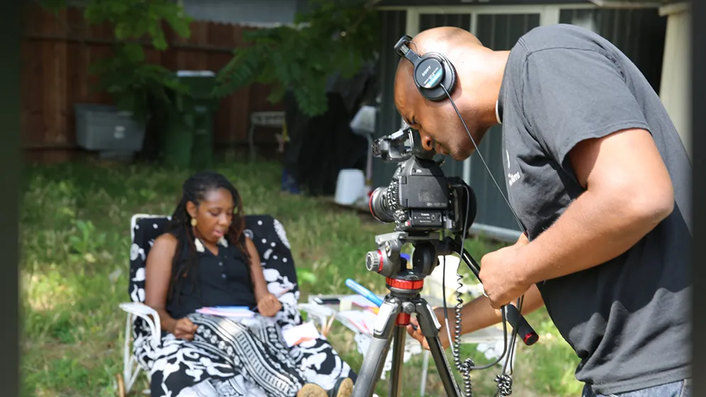 CSUSB alumnus Jay Gerren (behind the camera), shoots a scene for one of his films.