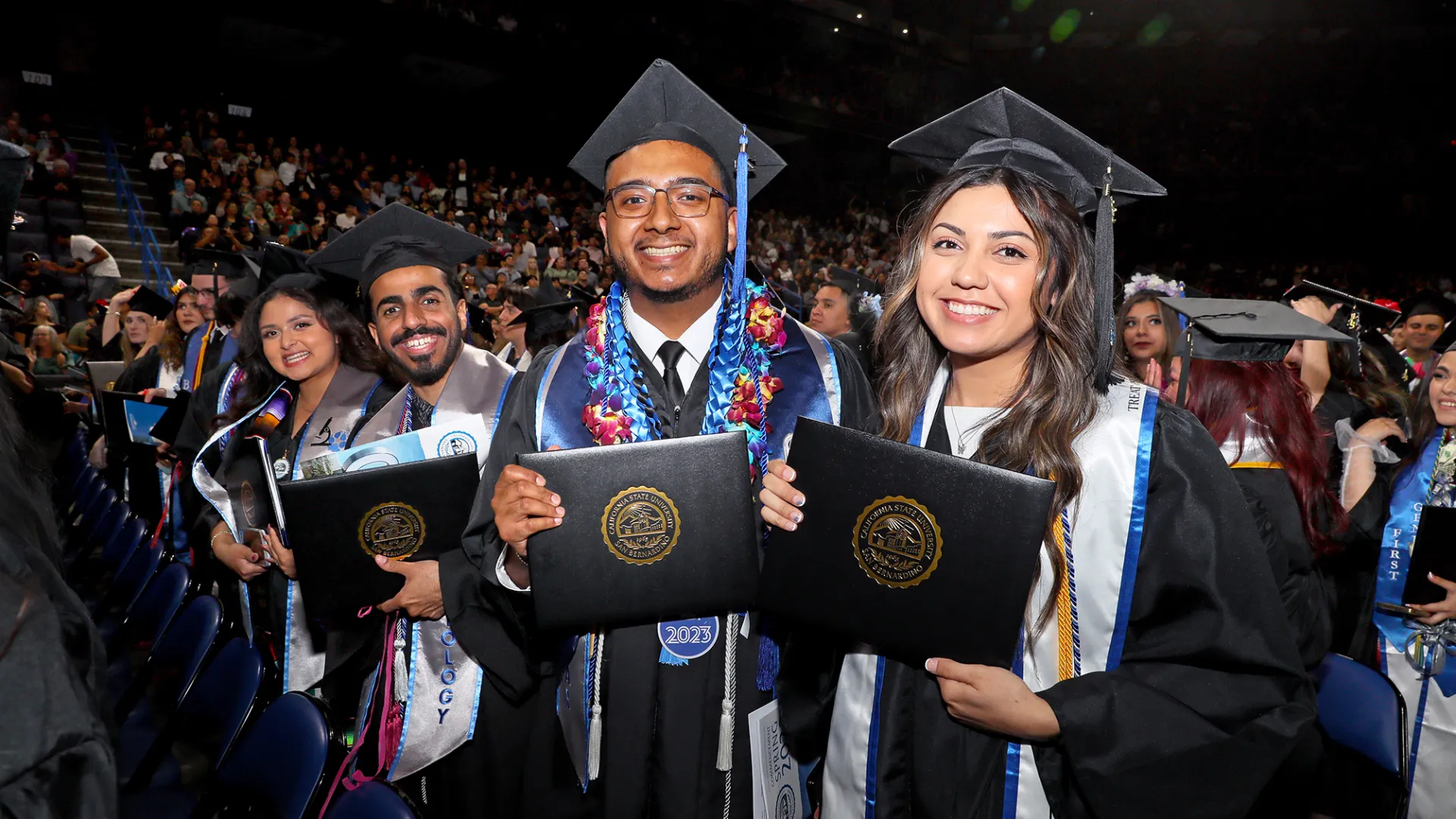 Students celebrate at the 2023 College of Natural Sciences Commencement ceremony at the Toyota Arena. 