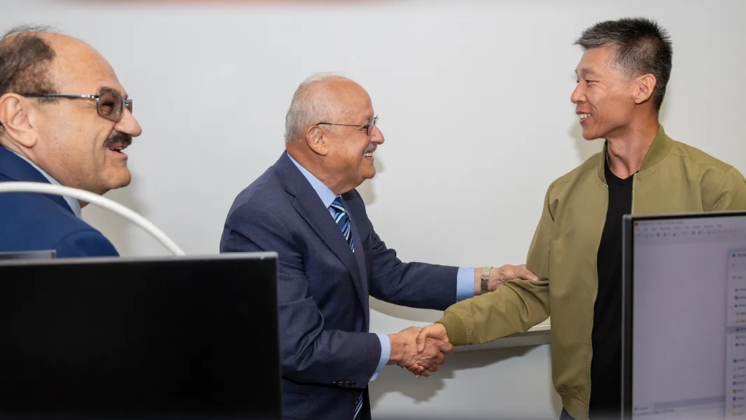 CSUSB President Tomás D. Morales with Qingquan Sun, professor in the School of Computer Science and Engineering