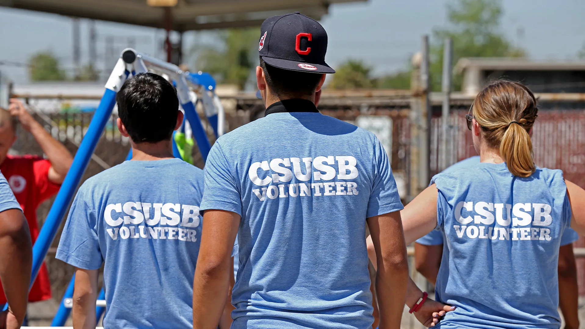 Students in T-shirts showing CSUSB Volunteer on their backs.