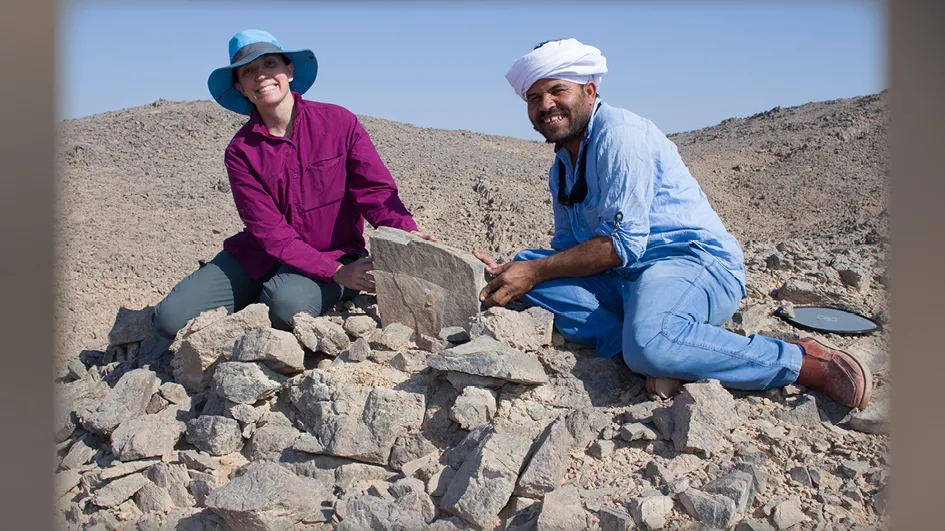Two members of Wadi el-Hudi Expedition at archaeological excavation site in Egypt.