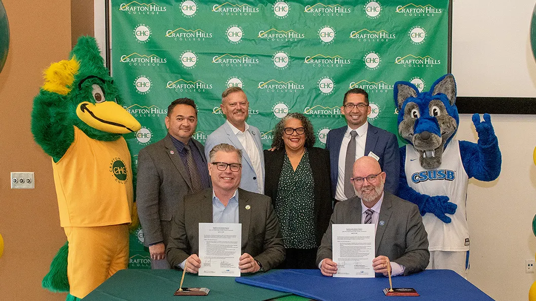 Kevin Horan, from bottom left, president of Crafton Hills College, and David Dufault-Hunter, vice president of CSUSB’s Strategic Enrollment Management and Marketing Division, signed a memorandum of understanding outlining the Coyotes on the Horizon partnership during a ceremony at Crafton Hills College on April 17. Administrators from both institutions were present, showcasing their support of the groundbreaking program.