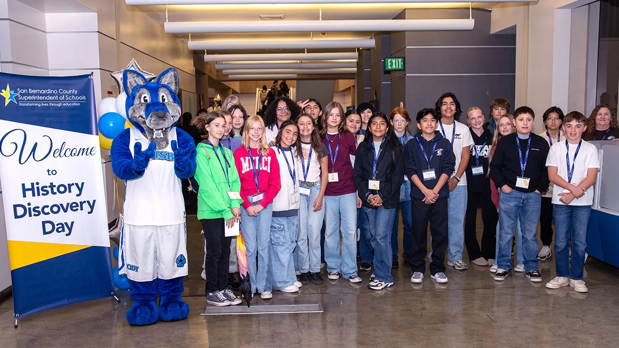A group of middle school students make their way through the bookstacks at Cal State San Bernardino’s John M. Pfau Library during San Bernardino County History Discovery Day on Nov. 14.
