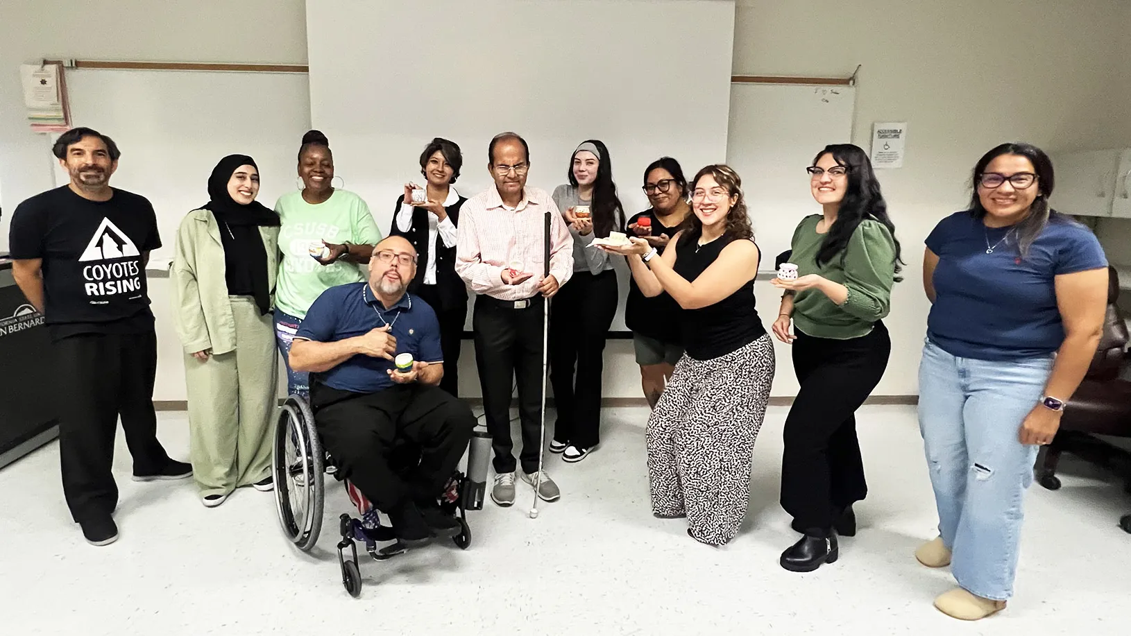 Participants at the recent Always Making Progress Campus Resources and Ceramic Painting Fall 2025 Open House. Abbas “Bobby” Quamar (center of the photo), associate professor of special education, rehabilitation and counseling at CSUSB, is developing the world’s first clinical assessment tool that measures how satisfied people with disabilities are when using internet-connected assistive devices (iCADs) with funding from the National Institute on Disability, Independent Living, and Rehabilitation Research.