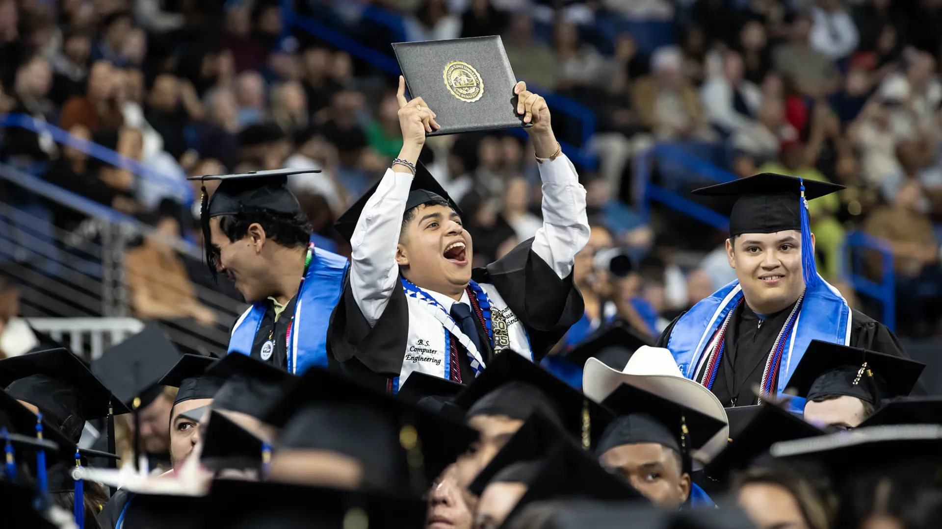 A member of CSUSB’s Class of 2025 celebrates during one of the five commencement ceremonies that took place in May