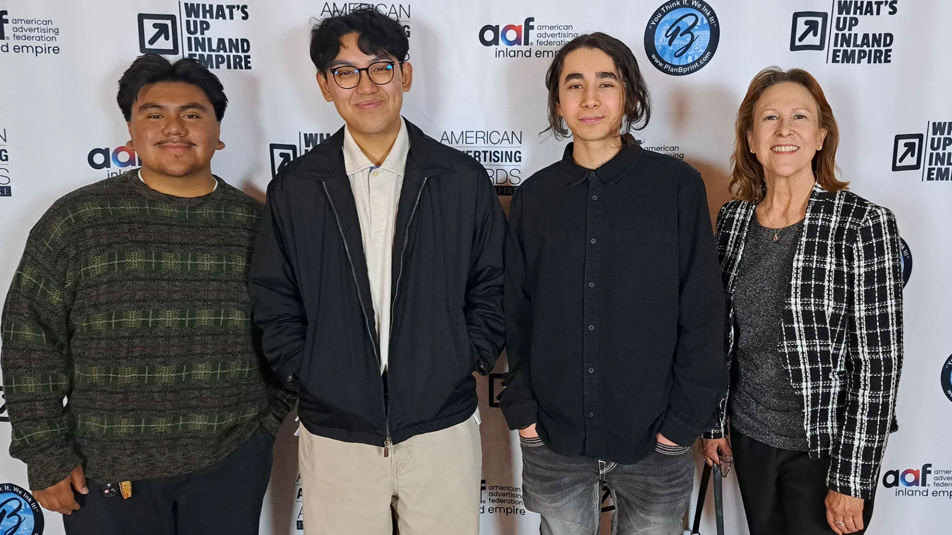 The students winning the silver ADDY Award are Isaac Abraham, Aaron Santos and Christopher Xavier. Picture with Coyote Radio & Advertising Operations Manager Kelli Cluque.