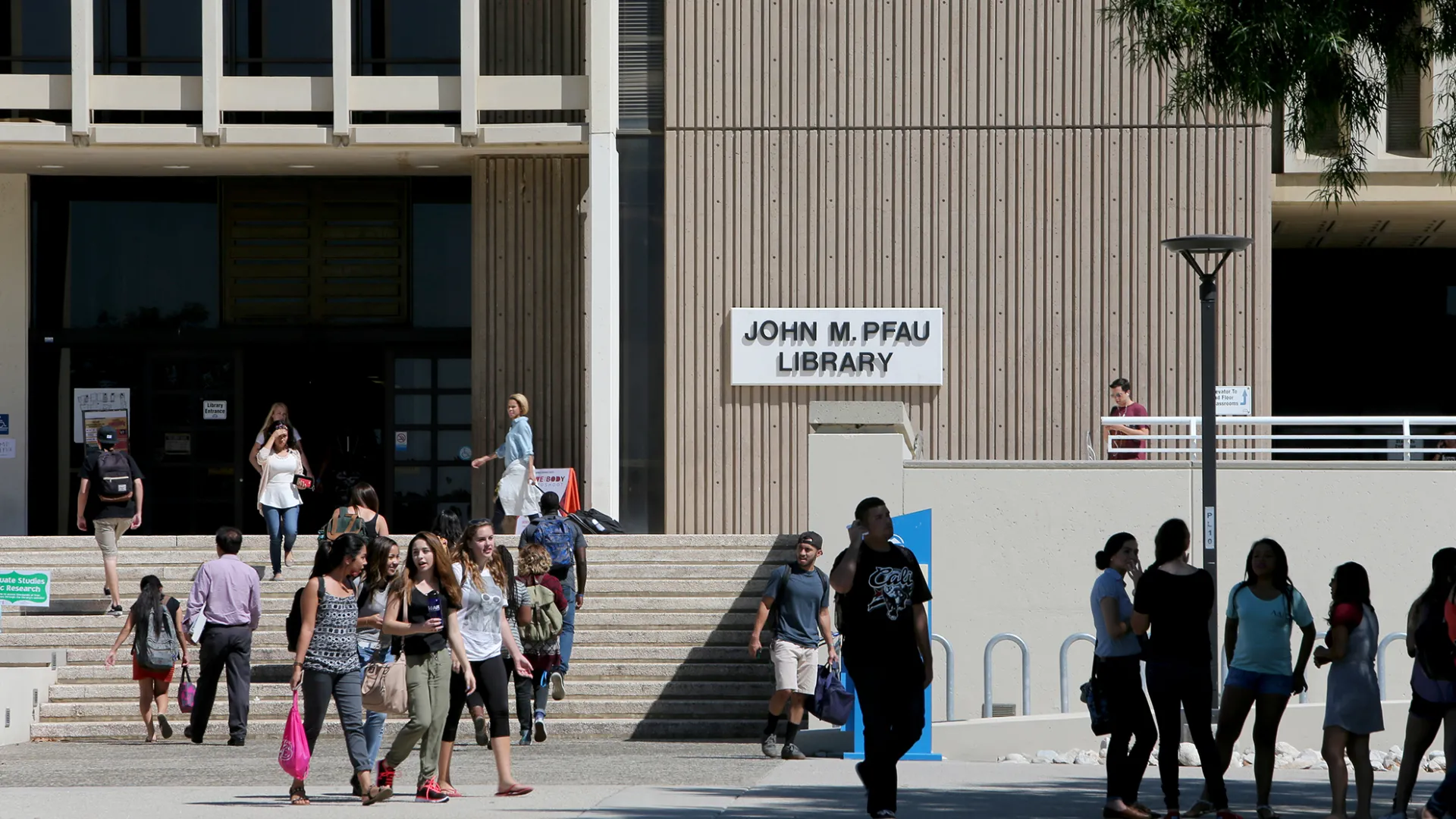 Students outside CSUSB's John M. Pfau Library.