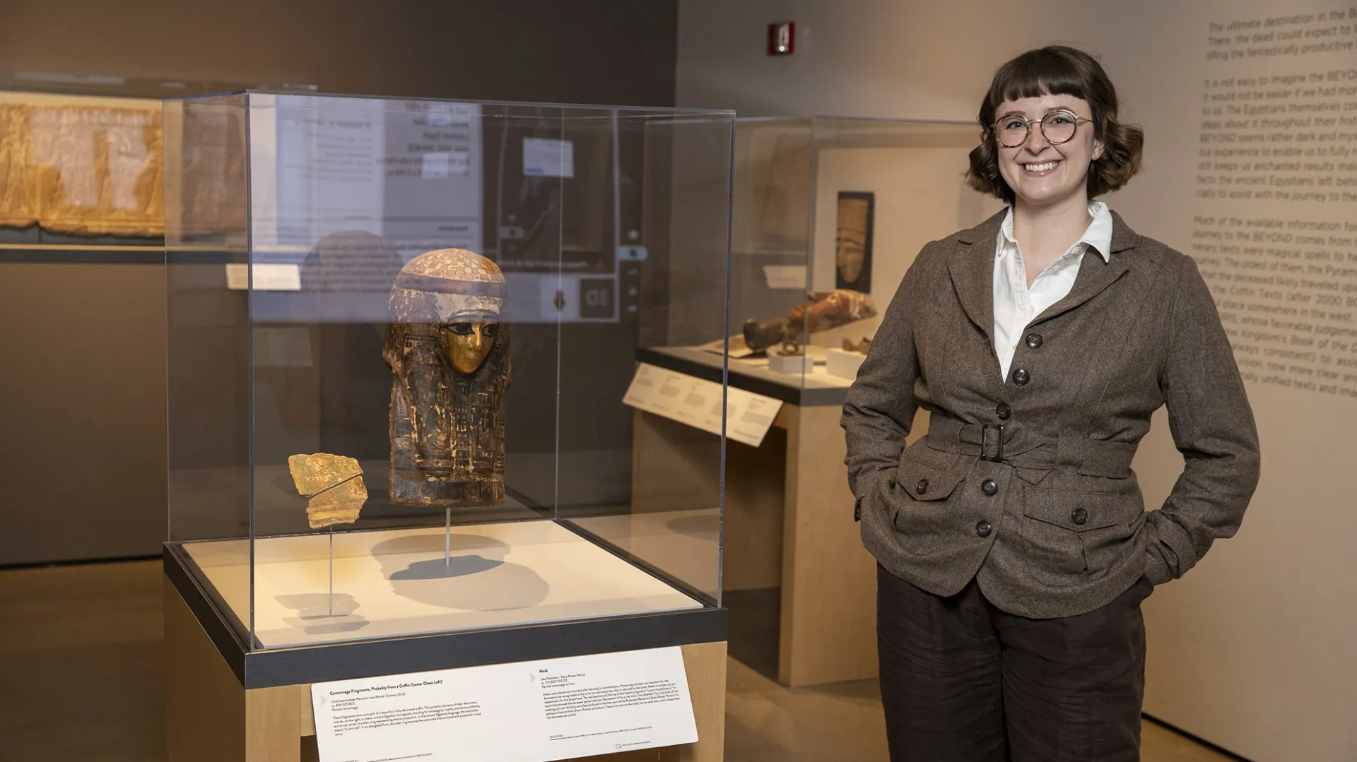 Emily Smith-Sangster among the Robert and Frances Fullerton Museum of Art’s collection of Ancient Egyptian artifacts.